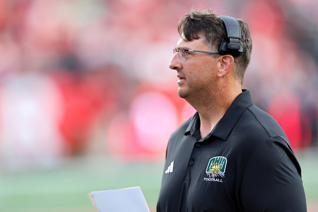 FILE - Ohio's head coach Brian Smith watches during an NCAA football game against Rutgers, Aug. 28, 2025, in Piscataway, N.J. (AP Photo/Gregory Payan, File)