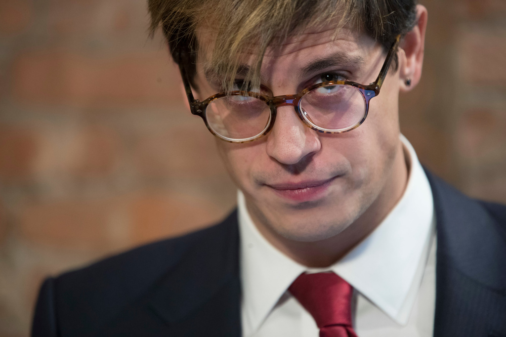 FILE - Milo Yiannopoulos pauses while speaking during a news conference in New York, Feb. 21, 2017. (AP Photo/Mary Altaffer, File)