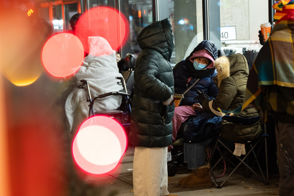 Black Friday Shoppers wait in line to enter Target on Friday, Nov. 28, 2025 in New York. (AP Photo/Angelina Katsanis)
