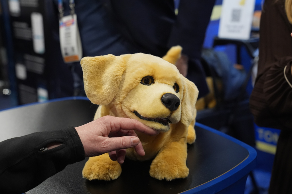A Tombot robotic puppy is pictured at a Tombot booth during the CES Unveiled tech show Sunday, Jan. 4, 2026, in Las Vegas. (AP Photo/Abbie Parr)