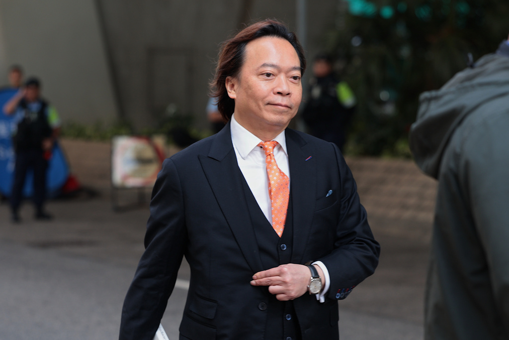 Pro-democracy activist Lawrence Lau Wai-chung arrives at the West Kowloon Law Courts Building ahead of the national security appeal cases, in Hong Kong, Monday, Feb. 23, 2026. (AP Photo/May James)