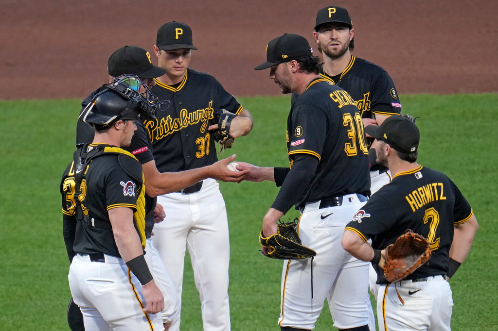Pittsburgh Pirates pitcher Paul Skenes (30) hands the ball to manager Don Kelly as he leaves the game during the sixth inning of a baseball game against the Chicago Cubs in Pittsburgh, Thursday, May 28, 2026. (AP Photo/Gene J. Puskar)