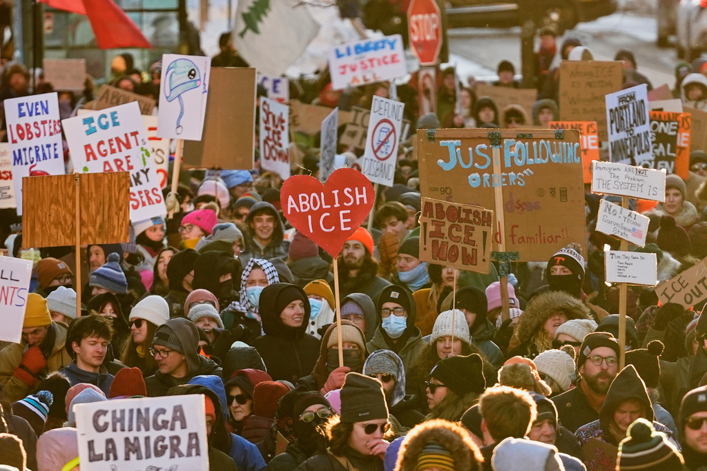 People protest against U.S. Immigrations and Customs enforcement in Portland, Maine, Friday, Jan. 30, 2026. (AP Photo/Robert F. Bukaty)