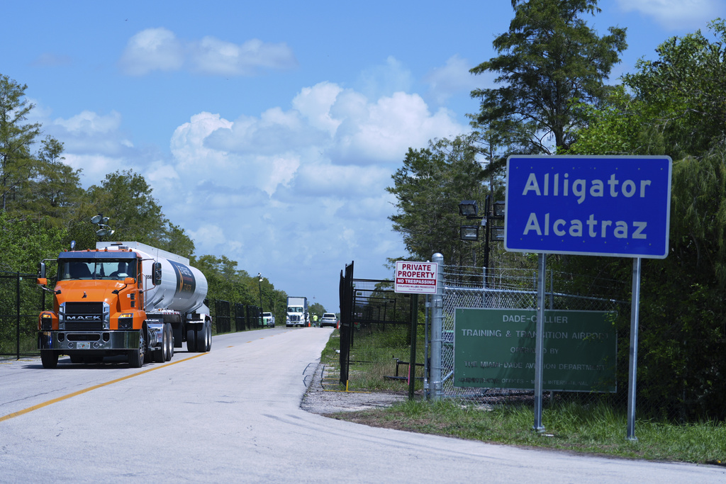 Trucks come and go from the "Alligator Alcatraz" immigration detention center in the Florida Everglades, Thursday, Aug. 28, 2025, in Collier County, Fla. (AP Photo/Rebecca Blackwell)