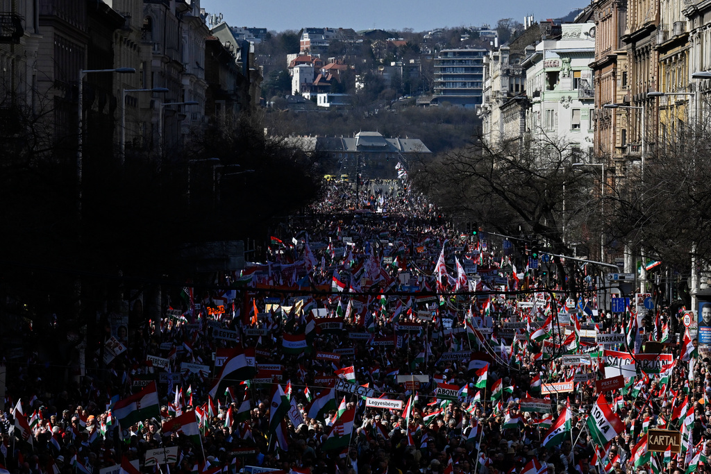 Supporters of Prime Minister Viktor Orban march through Budapest, Hungary, Sunday, March 15, 2026. (AP Photo/Denes Erdos)