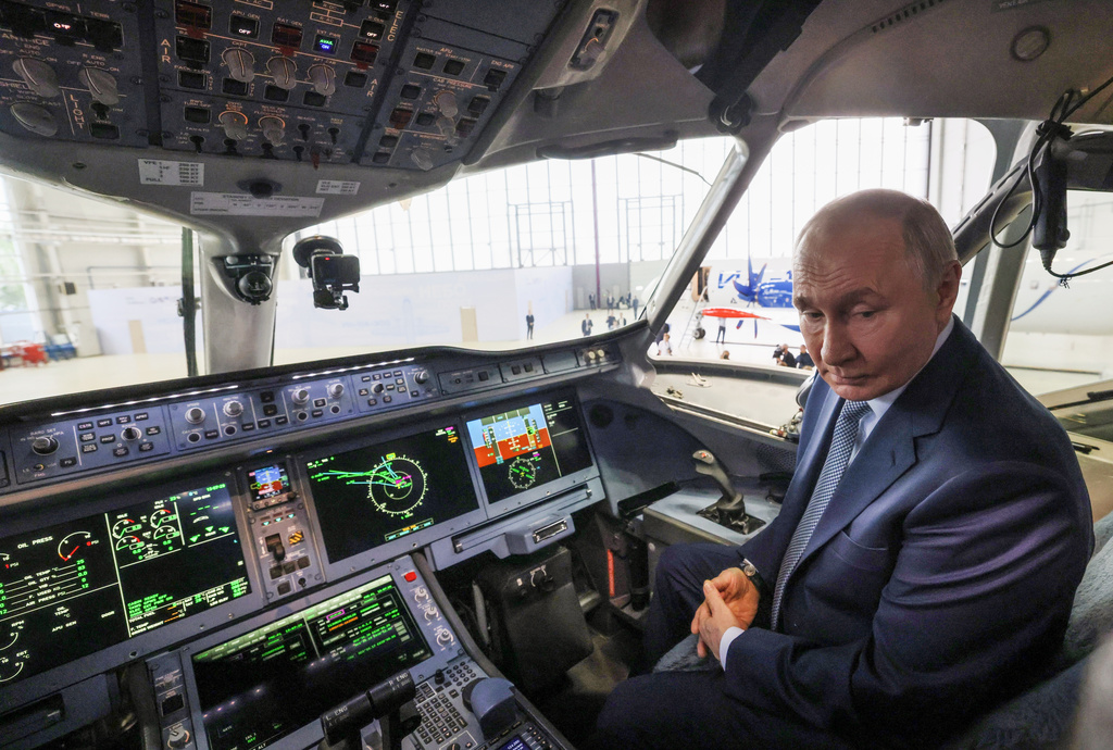 Russian President Vladimir Putin sits in the cockpit of the Superjet 100 (SJ-100) short-haul jet aircraft during a visit to the Gromov Flight Research Institute in Zhukovsky, outside Moscow, Wednesday, June 24, 2026. (Mikhail Metzel, Sputnik, Kremlin Pool Photo via AP)