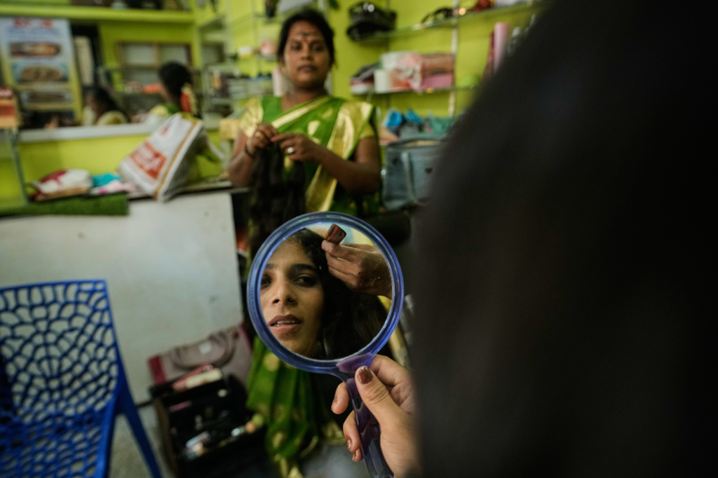Nazariya Kutty gets ready in a parlor to participate in the Koovagam transgender festival in Villupuram, in the southern Indian state of Tamil Nadu, Tuesday, April 28, 2026. (AP Photo/Mahesh Kumar A.)