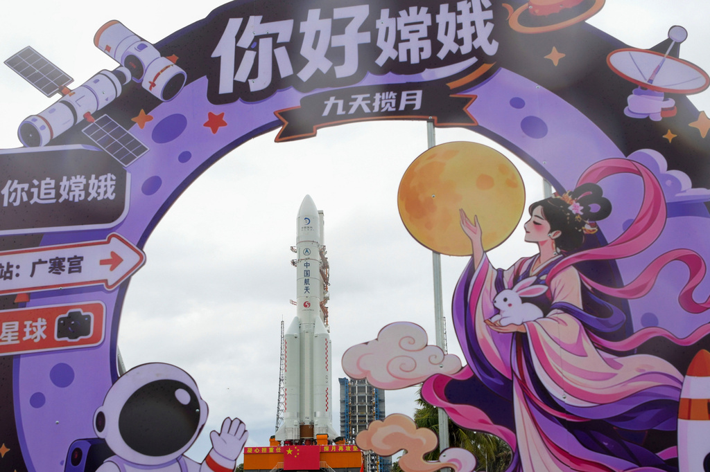 In this photo released by Xinhua News Agency, the combination of the Chang'e-7 lunar probe and the Long March-5 Y14 carrier rocket is transferred vertically to the launching area at the Wenchang Spacecraft Launch Site in southern China's Hainan Province on Wednesday, Aug. 19, 2026 . (Yang GuanyuXinhua via AP)