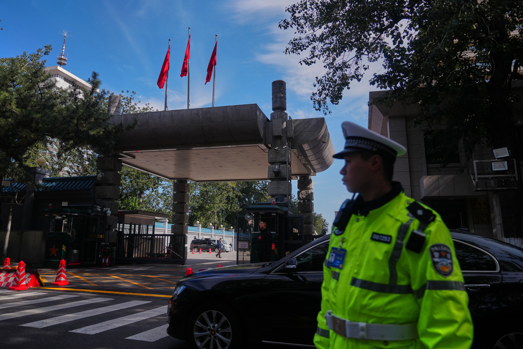 Chinese security personnel stand guard at the entrance to the Jingxi Hotel where the Communist Party's Central Committee is holding its fourth plenum, in Beijing, Monday, Oct. 20, 2025. (AP Photo/Andy Wong)