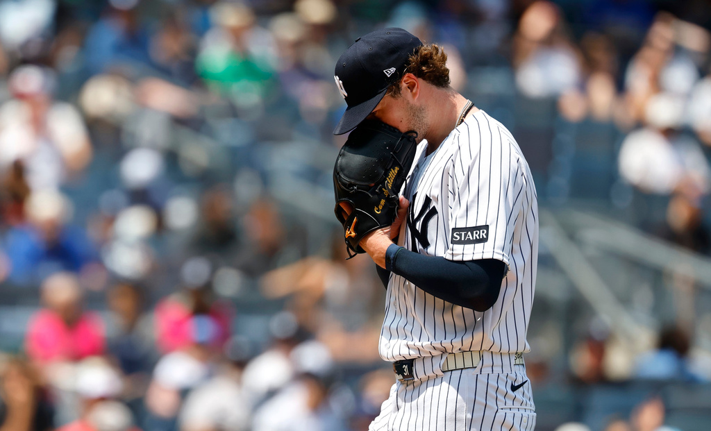 New York Yankees pitcher Cam Schlittler walks to the dugout during the fifth inning of the first game of a baseball doubleheader against the Los Angeles Dodgers, Sunday, July 19, 2026, in New York. (AP Photo/Noah K. Murray)
