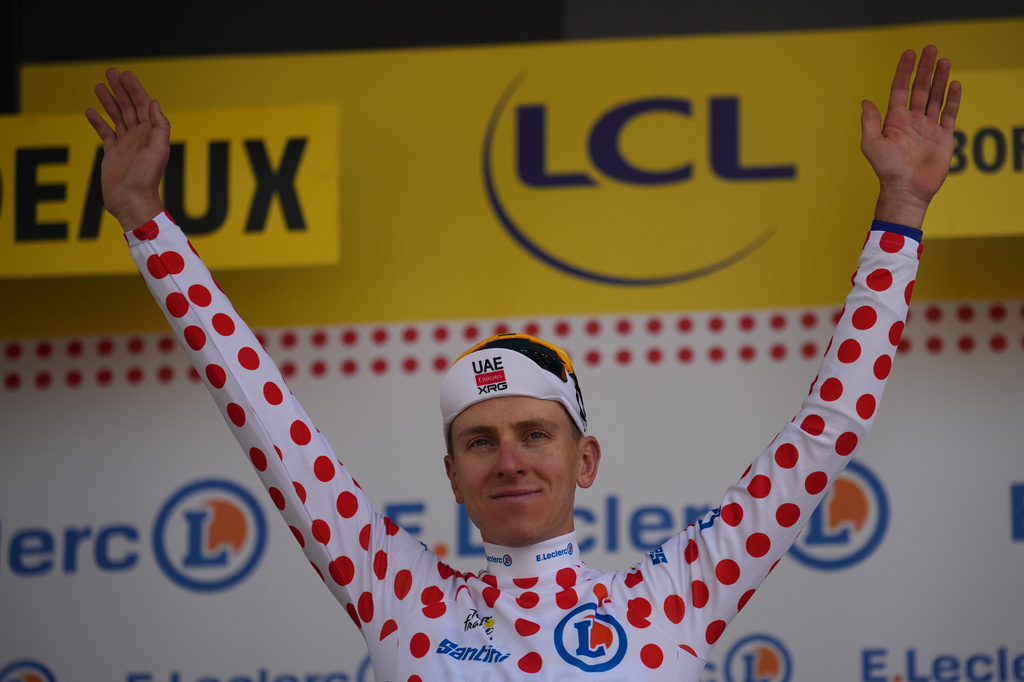 Slovenia's Tadej Pogacar, wearing the best climber's dotted jersey celebrates on the podium after the seventh stage of the Tour de France cycling race with start in Hagetmau and finish in Bordeaux, France, Friday, July 10, 2026. (AP Photo/Mosa'ab Elshamy)
