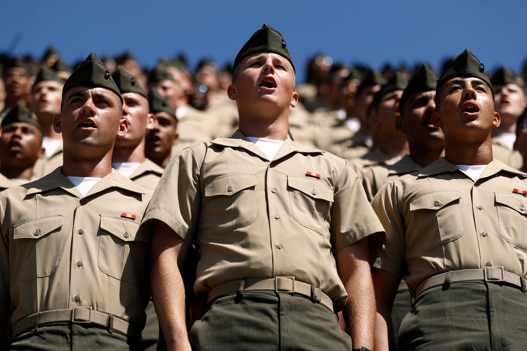 FILE - Recruits from Marine Corps Recruit Depot San Diego sing the Marine's Hymn during a baseball game between the San Diego Padres and the Colorado Rockies, Sept. 8, 2019, in San Diego. (AP Photo/Gregory Bull, File)