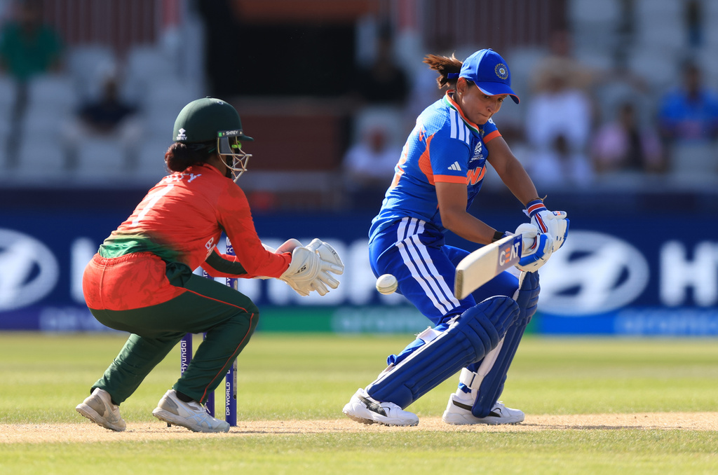 India's Harmanpreet Kaur, right,during the ICC Women's T20 World Cup cricket match between India and Bangladesh in Manchester, England Thursday, June 25, 2026. (Nigel French/PA via AP)