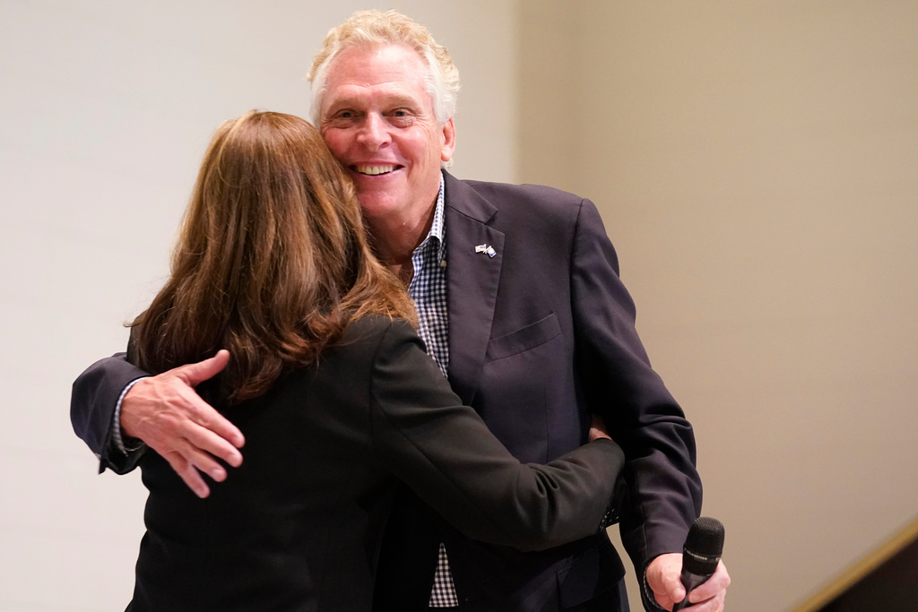 FILE - Democratic gubernatorial candidate, former Gov. Terry McAuliffe hugs his wife, Dorothy during a rally in Richmond, Va., Thursday, Oct. 28, 2021. McAuliffe will face Republican Glenn Youngkin in the November election. (AP Photo/Steve Helber, File)