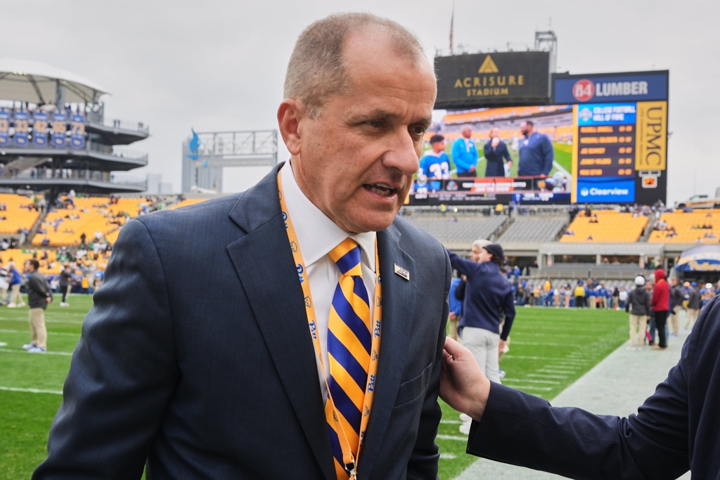 ACC Commissioner Jim Phillips walks on the field before an NCAA college football game between Pittsburgh and Notre Dame in Pittsburgh, Nov. 15, 2025. (AP Photo/Gene J. Puskar)