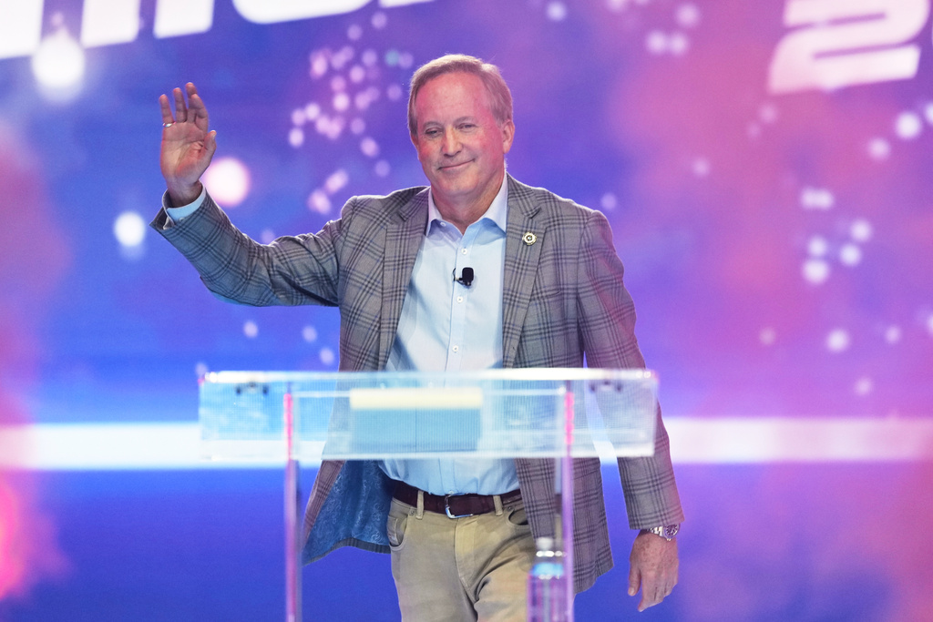 FILE - Texas Attorney General Ken Paxton takes the stage during Turning Point USA's AmericaFest 2025, Dec. 20, 2025, in Phoenix. (AP Photo/Ross D. Franklin, File)