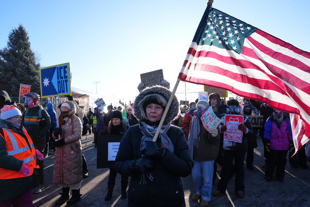 People gather for a protest against ICE outside the Bishop Henry Whipple Federal Building, Friday, Jan. 30, 2026, in Minneapolis. (AP Photo/Adam Gray)