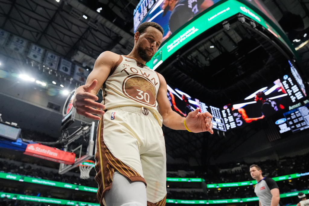 FILE - Golden State Warriors' Stephen Curry looks down during the second half of an NBA basketball game against the Dallas Mavericks, in Dallas, Jan. 22, 2026. (AP Photo/Tony Gutierrez, File)