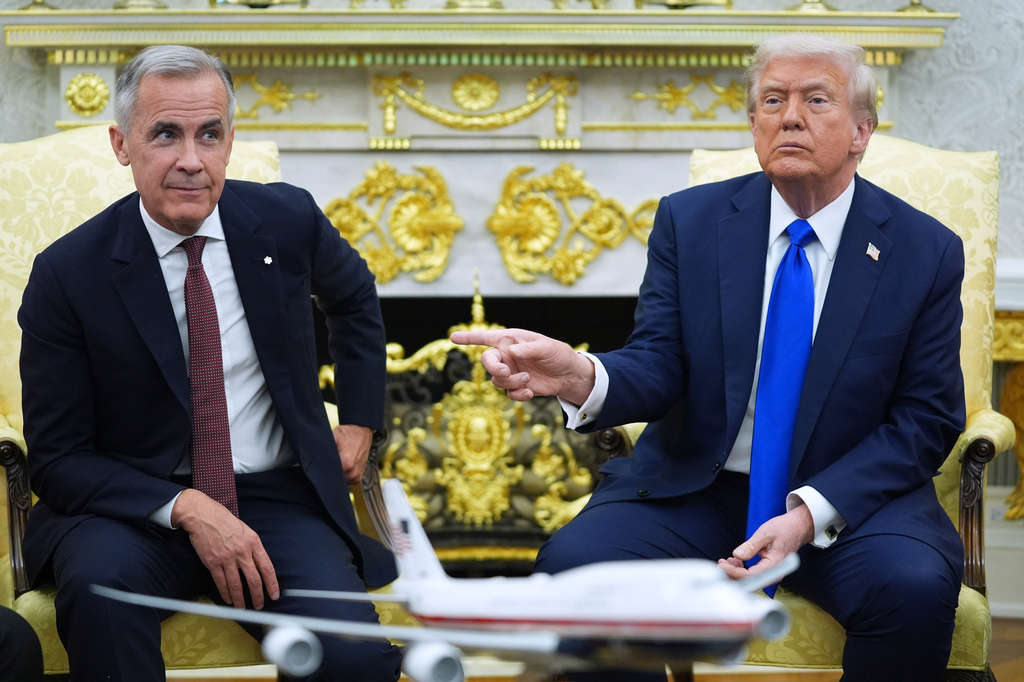 FILE - President Donald Trump and Canadian Prime Minister Mark Carney meet in the Oval Office of the White House, Oct. 7, 2025, in Washington. (AP Photo/Evan Vucci, File)