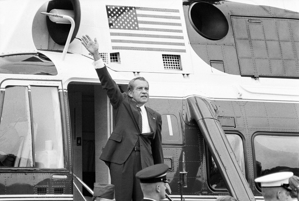 FILE -In this Aug. 9, 1974, file photo, President Richard Nixon waves goodbye from the steps of his helicopter outside the White House after delivering a farewell address to members of the White House staff. (AP Photo/Chick Harrity, File)