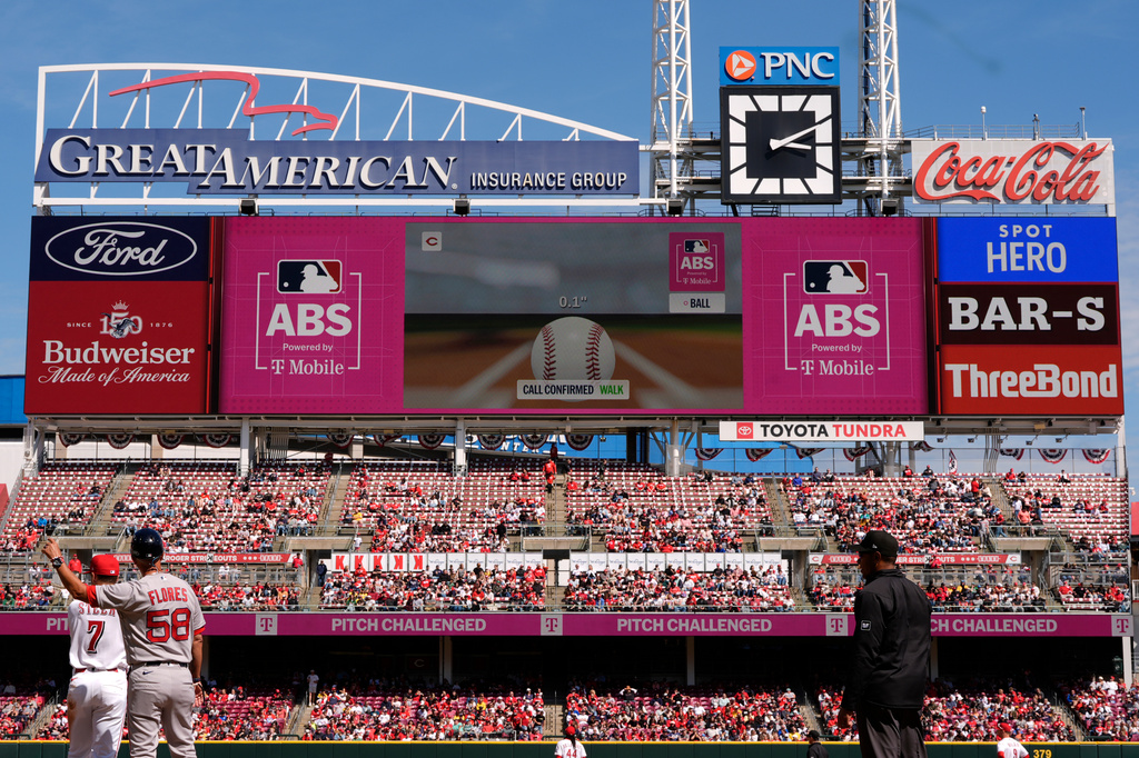Automated Ball-Strike Challenge System (ABS) confirms a call after Cincinnati Reds catcher Tyler Stephenson challenged (pitch result), call on the field, Boston Red Sox's Jarren Duran walks during the sixth inning of a baseball game in Cincinnati, Sunday, March 29, 2026. (AP Photo/Carolyn Kaster)