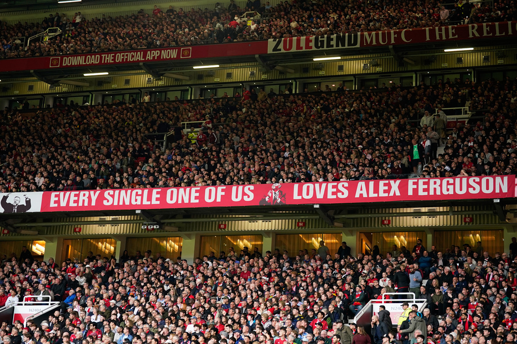 Manchester United fans cheer during the English Premier League soccer match between Manchester United and Liverpool in Manchester, England, Sunday, May 3, 2026. (AP Photo/Dave Thompson)