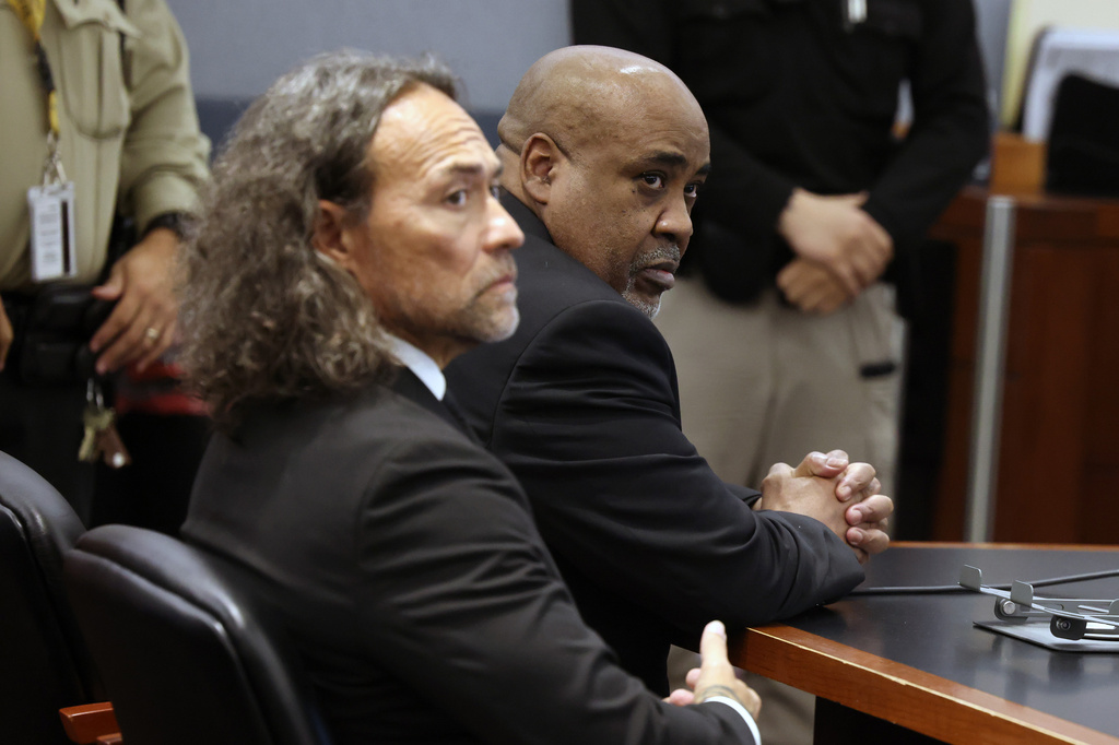 FILE - Duane Davis, right, and his attorney Michael Sanft sit in a courtroom, after a jury found Davis guilty of first-degree murder in his trial related to the 1996 killing of rapper Tupac Shakur, at Clark County District Court Regional Justice Center on Aug. 31, 2026, in Las Vegas. (Bizuayehu Tesfaye/Las Vegas Review-Journal via AP, Pool)