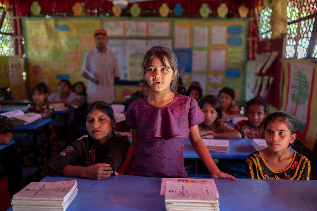 Rohingya refugee girls attend a class at their school in the Rohingya refugee camp in Cox's Bazar, Bangladesh, Wednesday, Nov. 26, 2025. (AP Photo/Mahmud Hossain Opu)