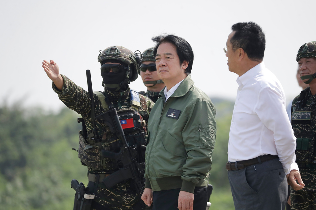 Taiwanese President Lai Ching-te, center, inspects Taiwan Navy conducting coastal strike and nearshore defense exercises during the annual Han Kuang military exercises in Kaohsiung, Southern Taiwan, Saturday, Aug. 8, 2026. (AP Photo/Chiang Ying-ying)
