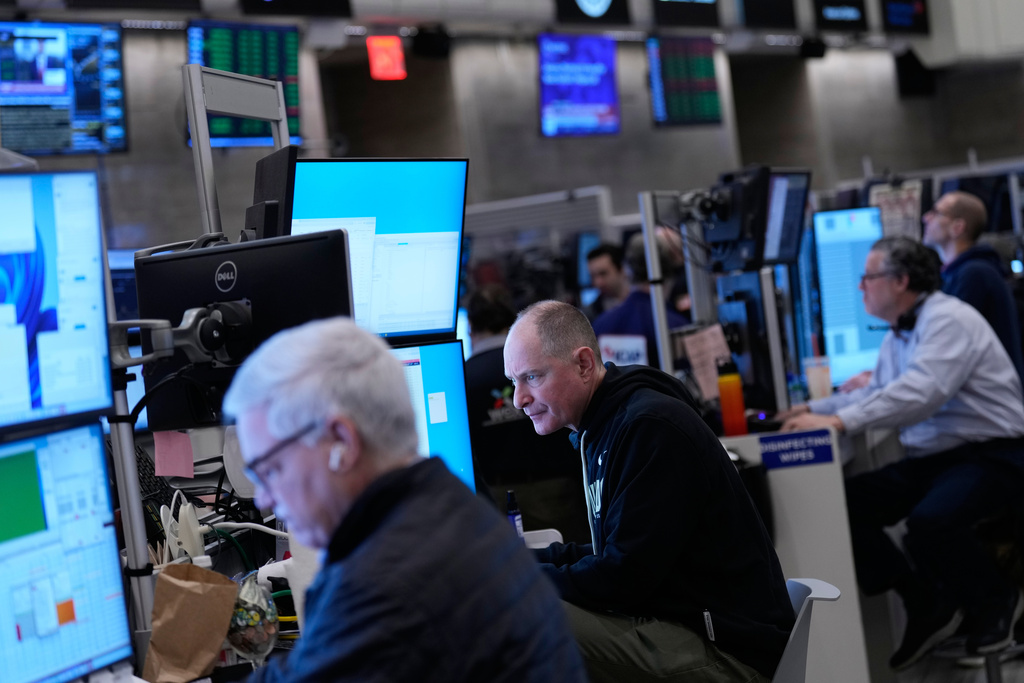 Traders work on the floor at the New York Stock Exchange in New York, Friday, Jan. 9, 2026. (AP Photo/Seth Wenig)