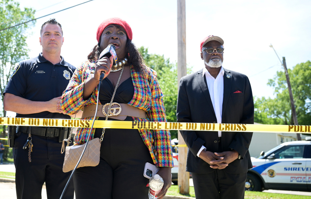 Satonia Small, with the organization Something Safe To Do, speaks to the news media and others gathered close to where a mass shooting took place in Shreveport, La., Sunday, April 19, 2026. (Jill Pickett/The Times-Picayune/The New Orleans Advocate via AP)