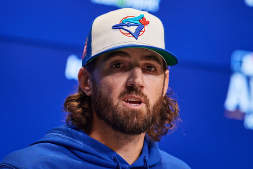 Toronto Blue Jays' Kevin Gausman speaks with the media ahead of Game 1 of baseball's American League Championship Series against the Seattle Mariners in Toronto, Saturday, Oct. 11, 2025. (Sammy Kogan/The Canadian Press via AP) Toronto Blue Jays' Kevin Gausman speaks with the media ahead of Game 1 of baseball's American League Championship Series against the Seattle Mariners in Toronto, Saturday, Oct. 11, 2025. (Sammy Kogan/The Canadian Press via AP)