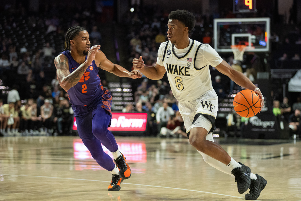 Wake Forest guard Myles Colvin (6) drives past Clemson guard Dillon Hunter (2) during the first half of an NCAA college basketball game Wednesday, Feb. 18, 2026, in Winston-Salem, N.C. (AP Photo/Scott Kinser)
