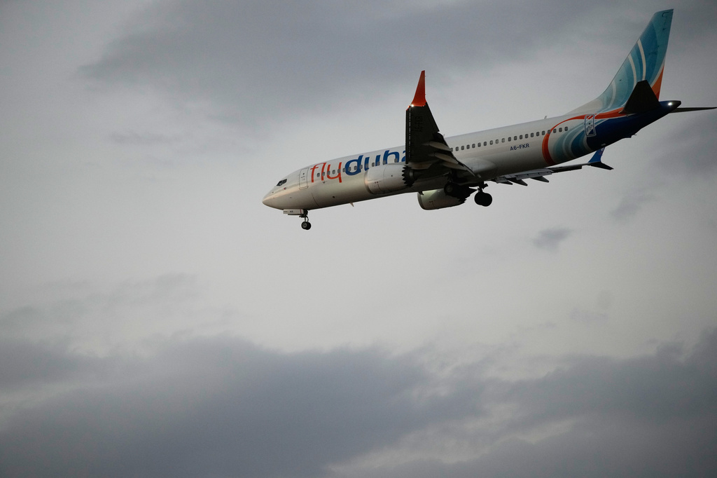 An FlyDubai plane carrying Israeli passengers who had earlier been aboard another FlyDubai aircraft that made an emergency landing in Saudi Arabia approaches Ben Gurion International Airport near Tel Aviv, Israel, Wednesday, Sept. 30, 2026. (AP Photo/Ohad Zwigenberg)