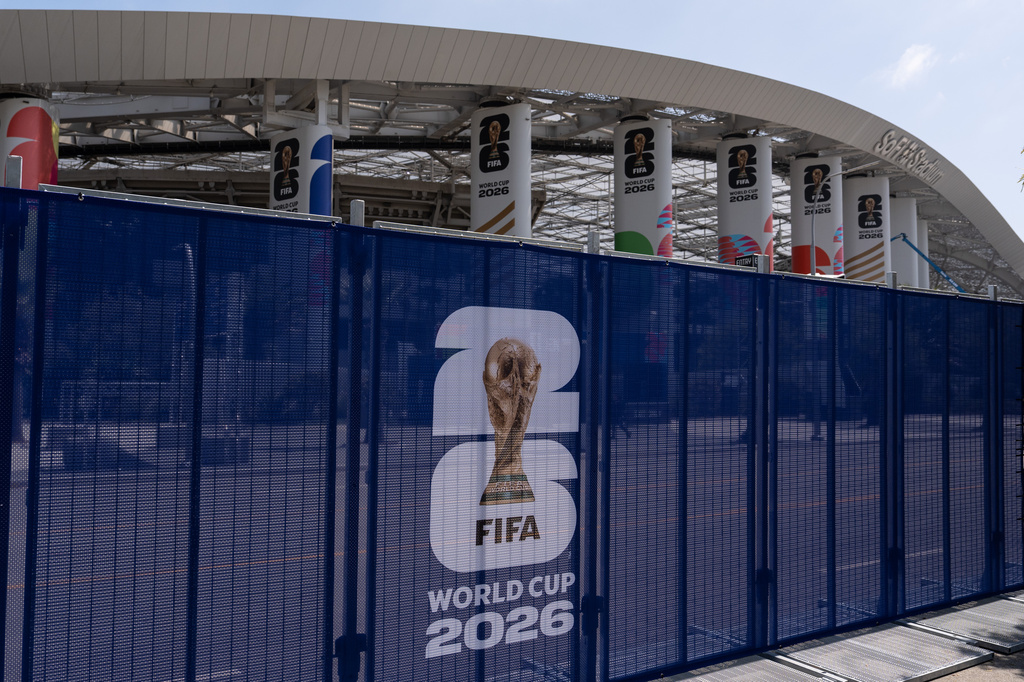 Temporary fencing with FIFA World Cup 2026 signage is set up outside SoFi Stadium, Friday, June 5, 2026, in Inglewood, Calif. (AP Photo/Jae C. Hong)