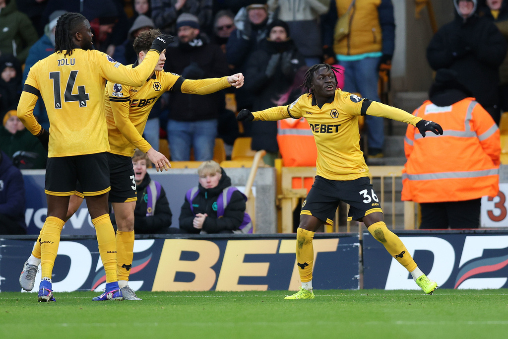 Wolverhampton Wanderers' Mateus Mane, right, celebrates after scoring his side's third goal during the English Premier League soccer match between Wolverhampton Wanderers and West Ham United in Wolverhampton, England, Saturday, Jan. 3, 2026. (Nigel French/PA via AP)