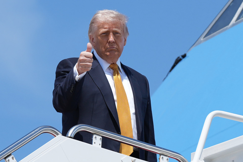 President Donald Trump boards Air Force One Tuesday, May 12, 2026, at Joint Base Andrews, Md., for a trip to China. (AP Photo/Mark Schiefelbein)