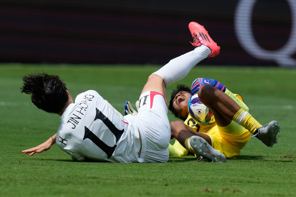 Bangladesh's goalkeeper Mile Akter, right, and North Korea's Han Jin Hong collide during their Women's Asian Cup Soccer match in Sydney, Friday, March 6, 2026. (AP Photo/Rick Rycroft)