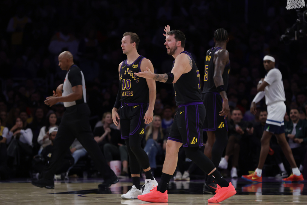 Los Angeles Lakers guard Luka Doncic (77) reacts during the first half of an NBA basketball game against the Minnesota Timberwolves, Tuesday, March 10, 2026, in Los Angeles. (AP Photo/Ethan Swope)
