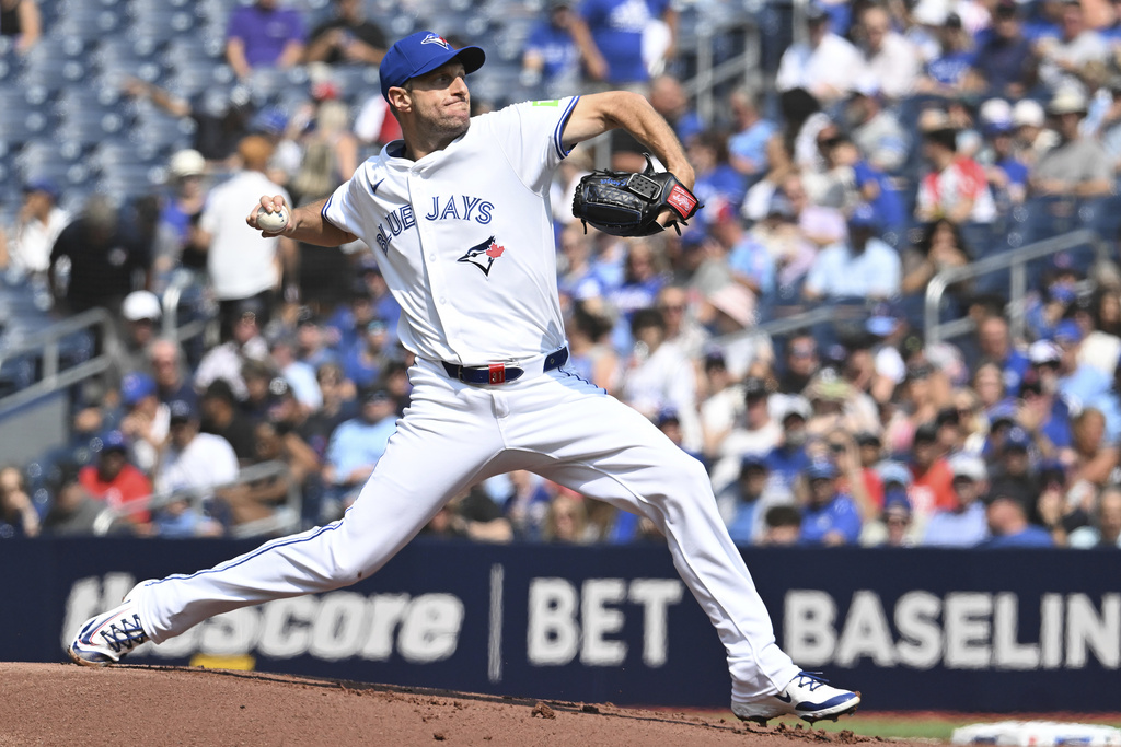 Toronto Blue Jays starting pitcher Max Scherzer (31) throws during the first inning of a baseball game against the Chicago Cubs, Thursday, Aug. 14, 2025, in Toronto. (Jon Blacker/The Canadian Press via AP)