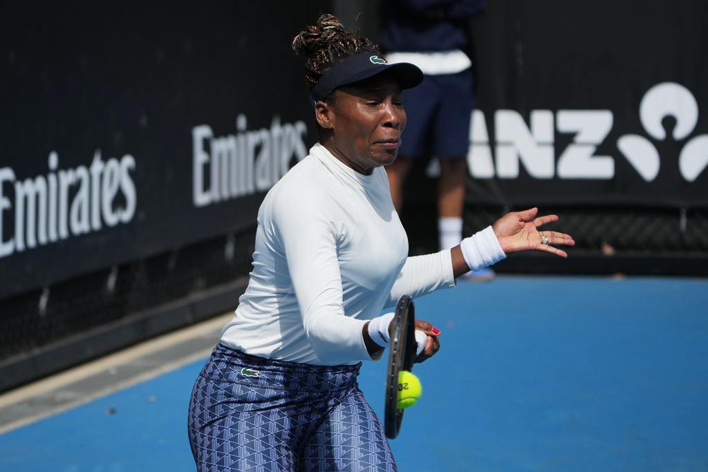 Venus Williams of the United States plays a forehand return to during a practice session ahead of the Australian Open tennis championship in Melbourne, Australia, Friday, Jan. 16, 2026. (AP Photo/Dita Alangkara)