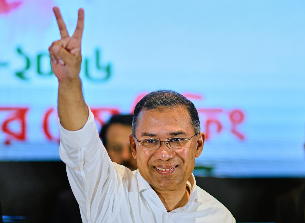 Bangladesh Nationalist Party Chairperson Tarique Rahman shows victory sign during a meeting with media after his party won the national parliamentary election, in Dhaka, Bangladesh, Saturday, Feb. 14, 2026. (AP Photo/Mahmud Hossain Opu)