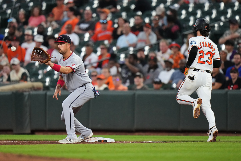 Baltimore Orioles' Blaze Alexander (23) is unable to beat the throw to Cleveland Guardians first baseman Nathaniel Lowe, left, during the third inning of a baseball game, Tuesday, Sept. 8, 2026, in Baltimore. (AP Photo/Stephanie Scarbrough)