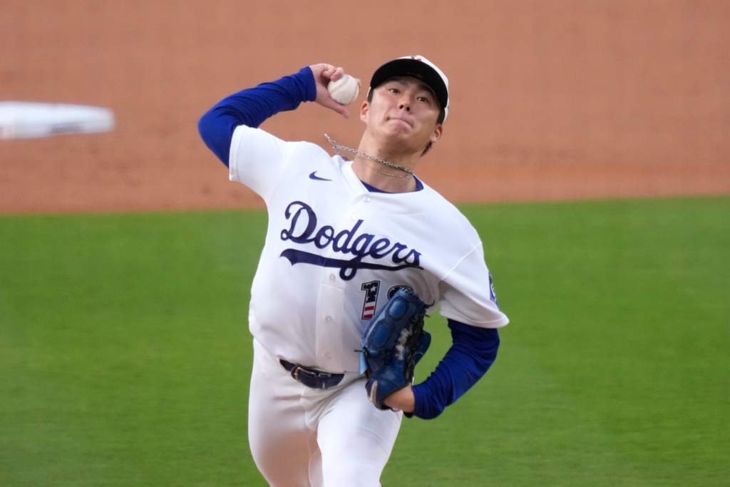 Los Angeles Dodgers starting pitcher Yoshinobu Yamamoto throws to the plate during the first inning of a baseball game against the San Diego Padres, Saturday, July 4, 2026, in Los Angeles. (AP Photo/Mark J. Terrill)