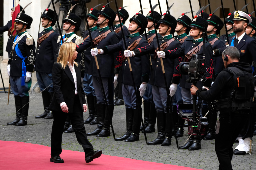 FILE - New Italian Premier Giorgia Meloni arrives for the handover ceremony at Chigi Palace Premier's office, in Rome, Sunday, Oct. 23, 2022. (AP Photo/Alessandra Tarantino, File)