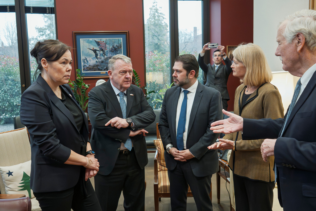 From left, Greenland Foreign Minister Vivian Motzfeldt, Danish Foreign Minister Lars Løkke Rasmussen, Sen. Ruben Gallego, D-Ariz., Sen. Lisa Murkowski, R-Alaska, and Sen. Angus King, I-Maine, begin a meeting on Capitol Hill as officials from Denmark and Greenland meet with lawmakers from the Arctic Caucus, at the Capitol in Washington, Wednesday, Jan. 14, 2026. (AP Photo/J. Scott Applewhite)