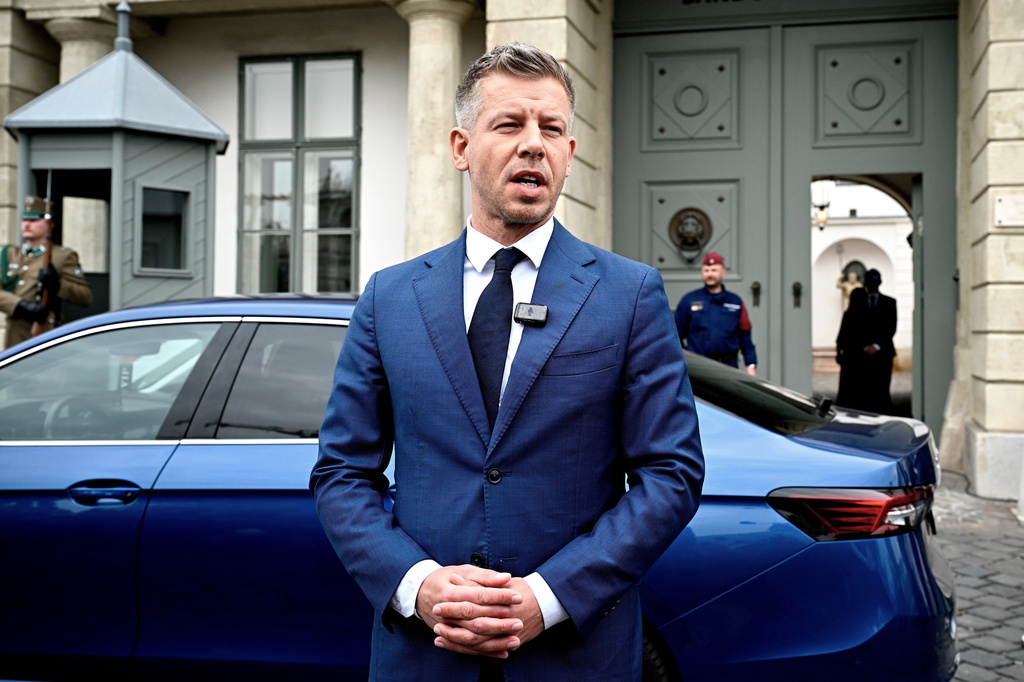 Peter Magyar, leader of the election-winning Tisza Party, talks to the media before meeting Hungarian President Tamas Sulyok in the presidential Alexander Palace in Budapest, Hungary, Wednesday April 15, 2026. (Robert Hegedus/MTI via AP)