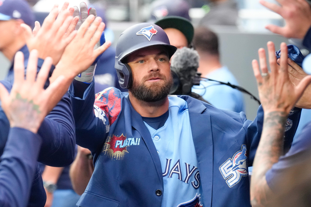 Toronto Blue Jays' Nathan Lukes (38) celebrates in the dug out after hitting a solo home run against the Houston Astros during the first inning of a baseball game in Toronto on Wednesday, June 24, 2026. (Chris Young/The Canadian Press via AP)