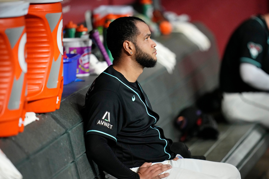 Arizona Diamondbacks starting pitcher Eduardo Rodriguez sits in the team dugout after the first inning of a baseball game against the New York Yankees, Friday, Sept. 18, 2026, in Phoenix. (AP Photo/Ross D. Franklin)
