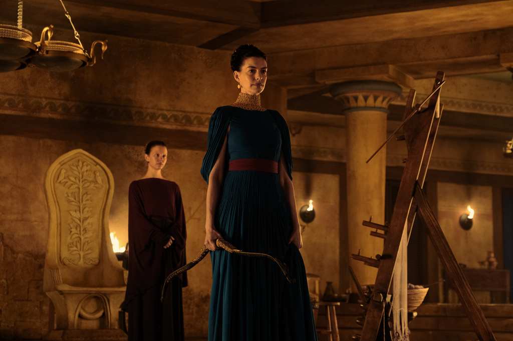 This image released by Universal Pictures shows, from left, Mia Goth as Melantho, and Anne Hathaway as Penelope, in a scene from "The Odyssey." (Melinda Sue Gordon/Universal Pictures via AP)